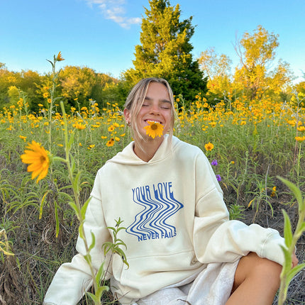 Love Never Fails Cream Unisex Hoodie