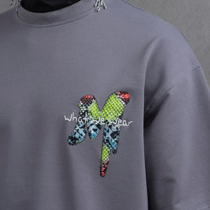 Oversize Graphic Cotton Tee – "What We Wear" Abstract Print