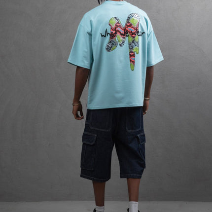 Oversize Graphic Cotton Tee – "What We Wear" Abstract Print